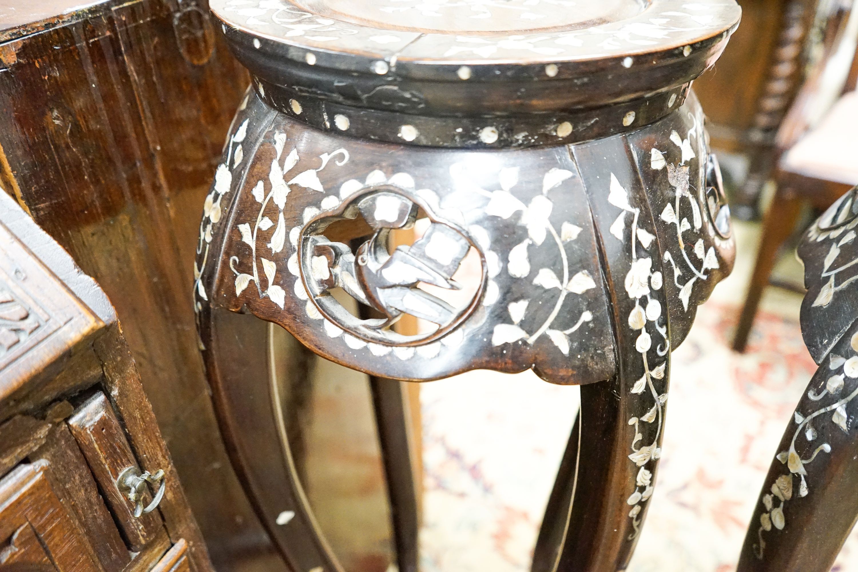 A pair of Chinese mother of pearl inset hardwood vase stands, height 92cm